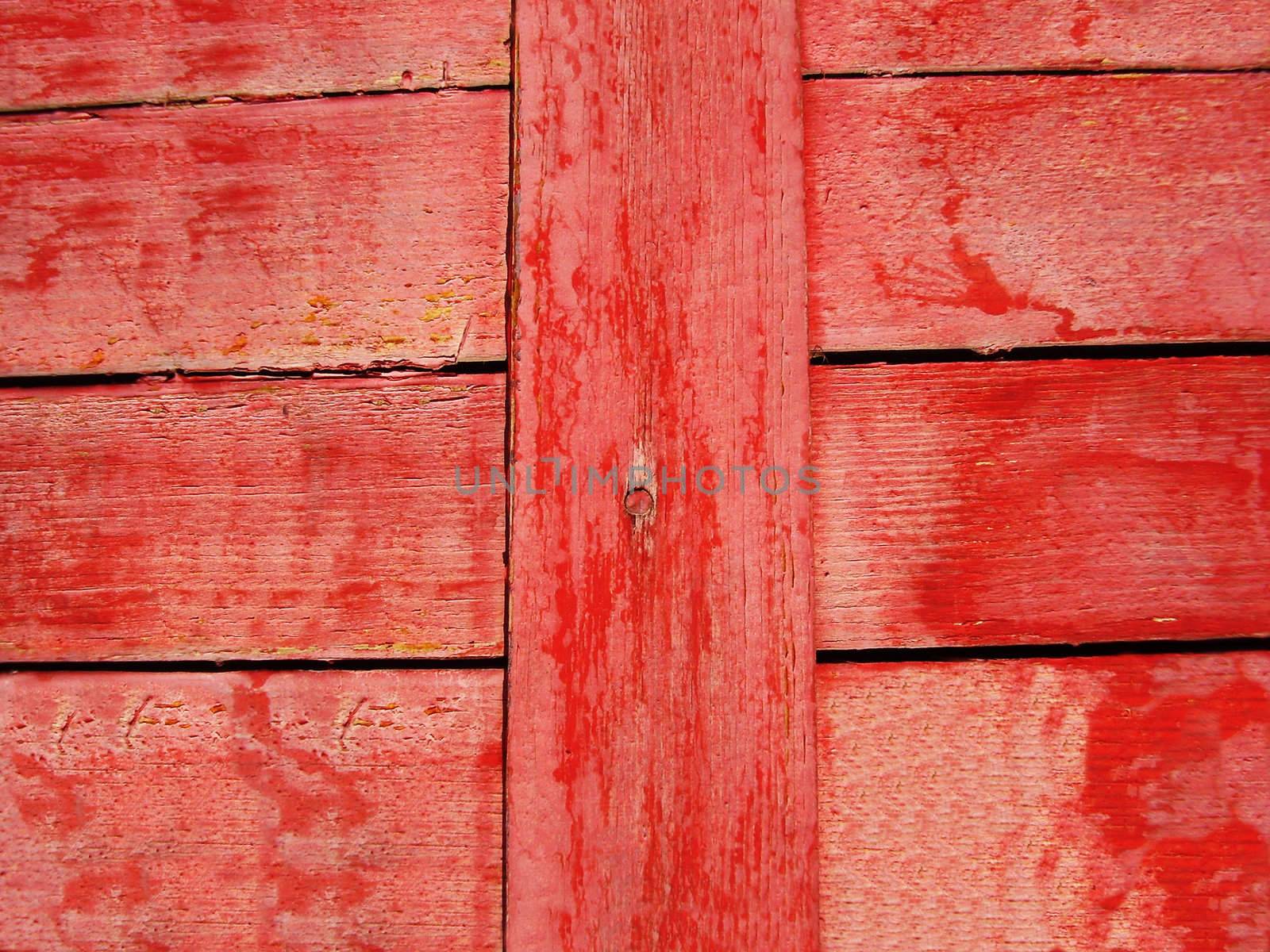 Closing on red wooden panels of the fence     