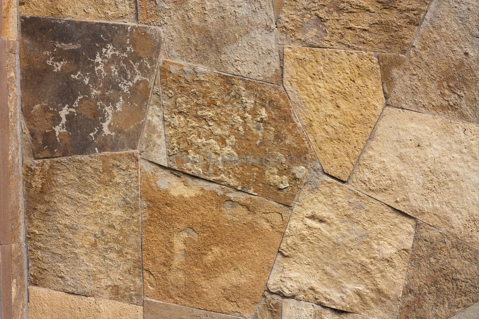 Unshaped stone wall pattern,wall made of rocks 