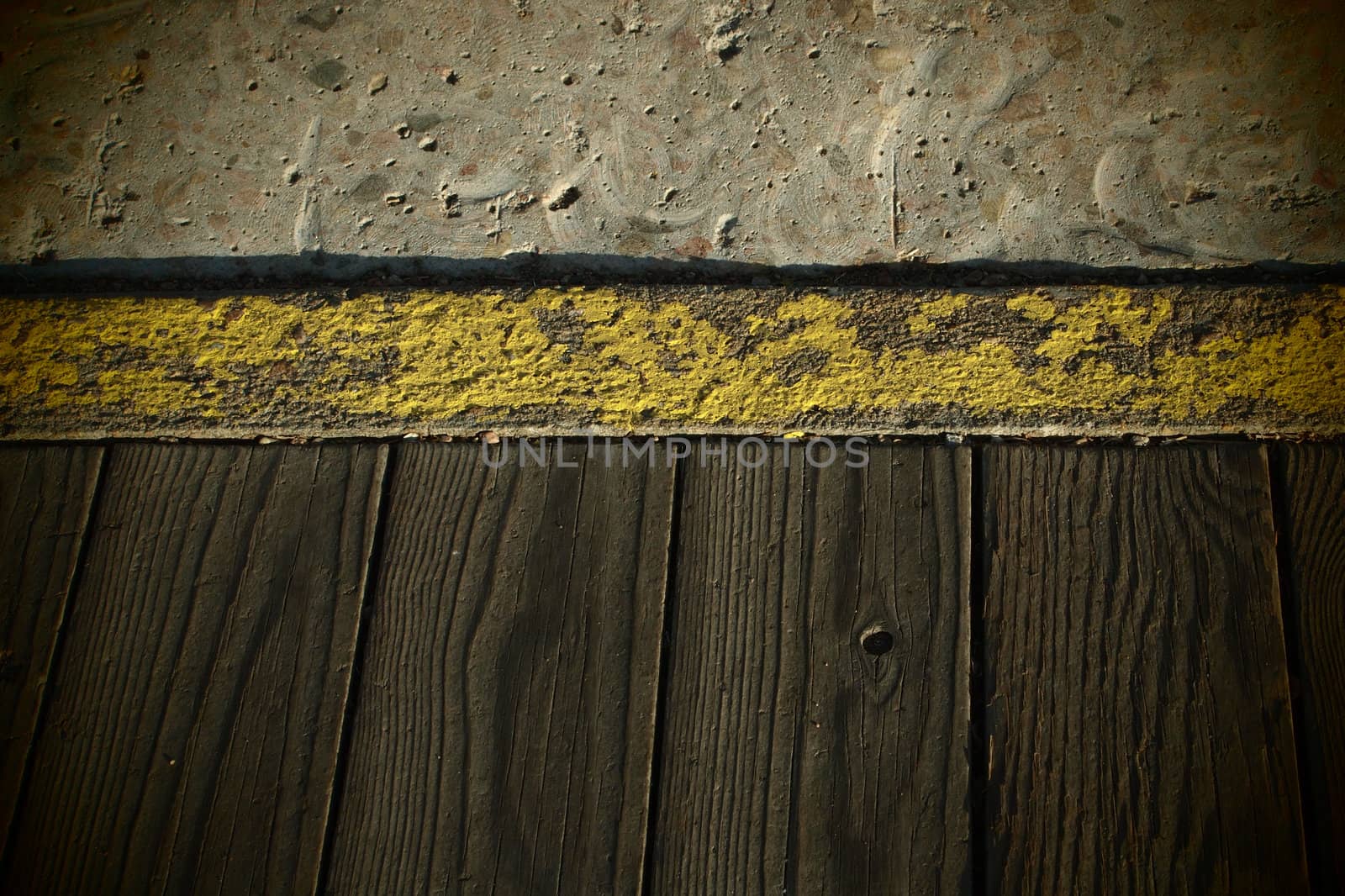 Grungy wood and concrete teture with vignetting.