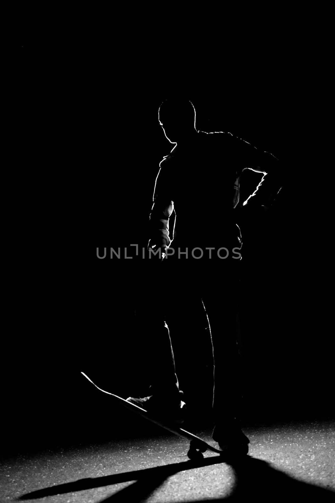 Back Lit Skateboarder Silhouette by graficallyminded