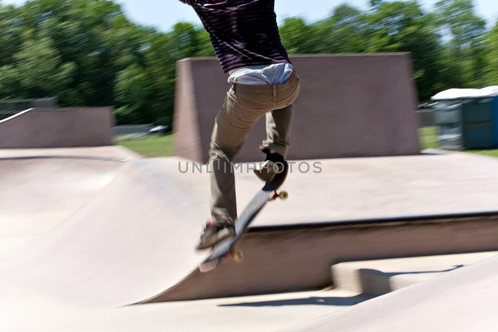 Skater Jumping at the Concrete Skate Park by graficallyminded