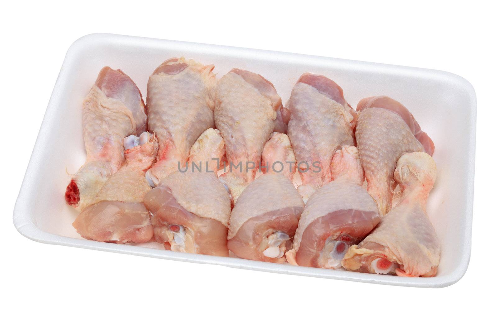 Image of a polystyrene tray with raw chicken drumsticks isolated against a white background.The file include clipping path.