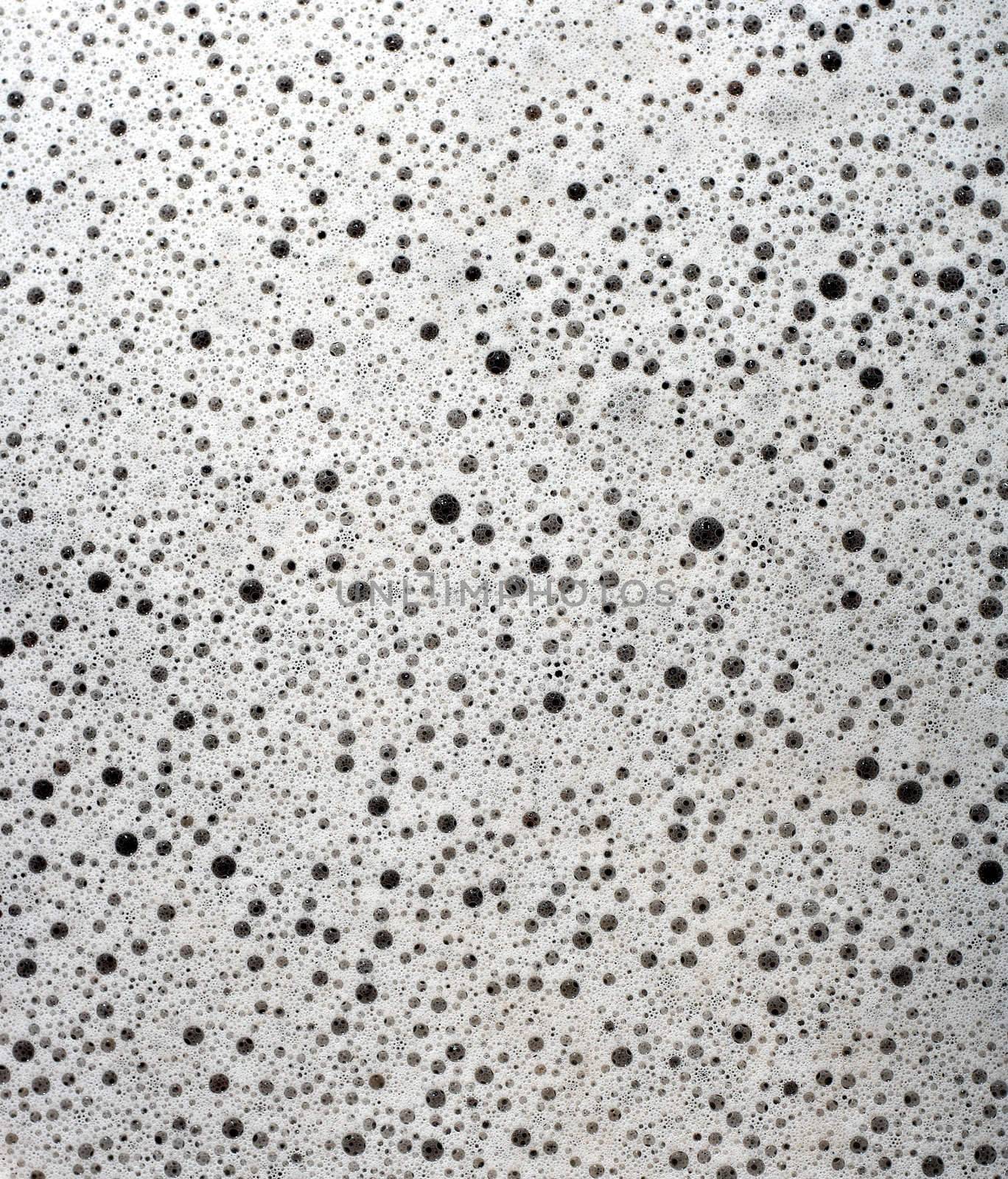 Bubbles of dirty soapy water background.