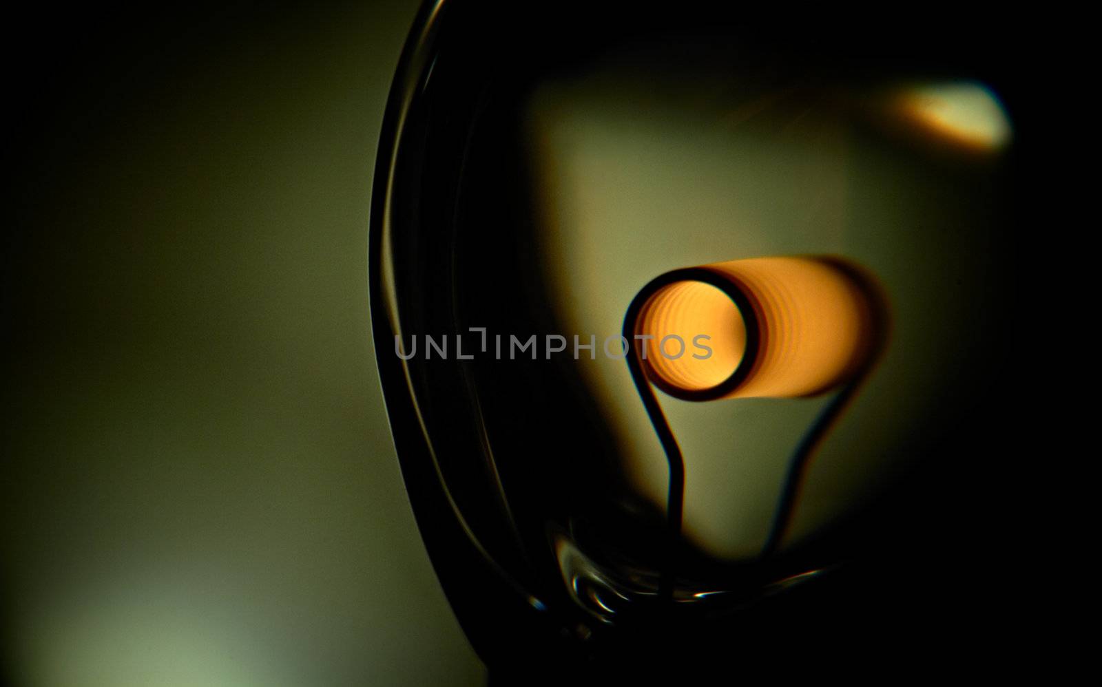 Glower is heated. Conceptual shot of incandescent lamp in green. by pashabo
