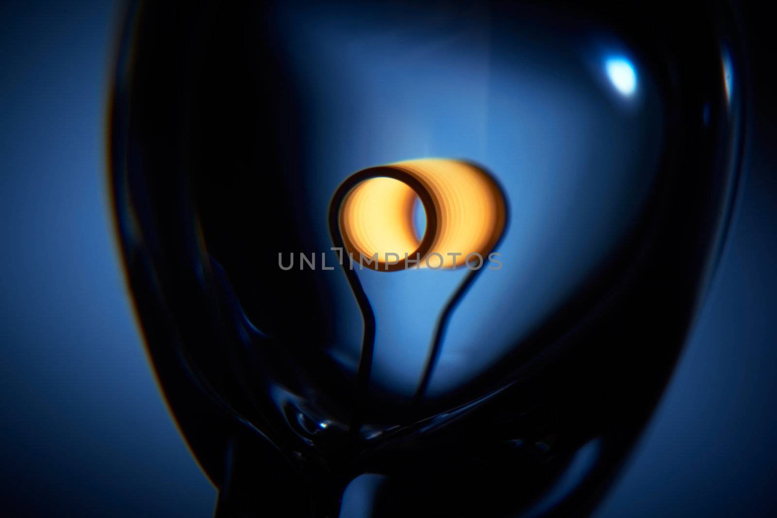Glower is heated. Conceptual shot of incandescent lamp in blue. by pashabo