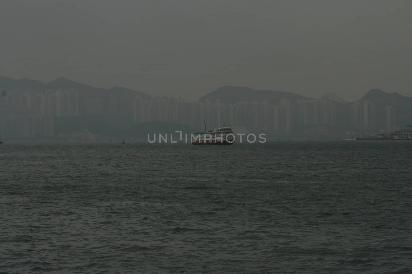 Ship against the Hong Kong skyline as seen from th by koep