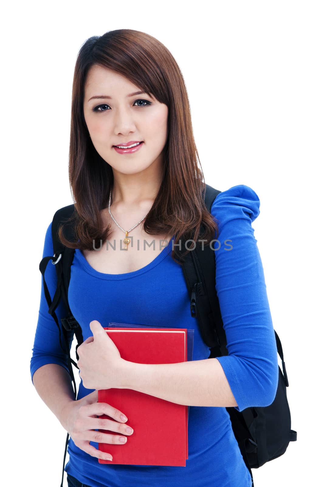 Portrait of a beautiful female student holding her books, isolated on white background.