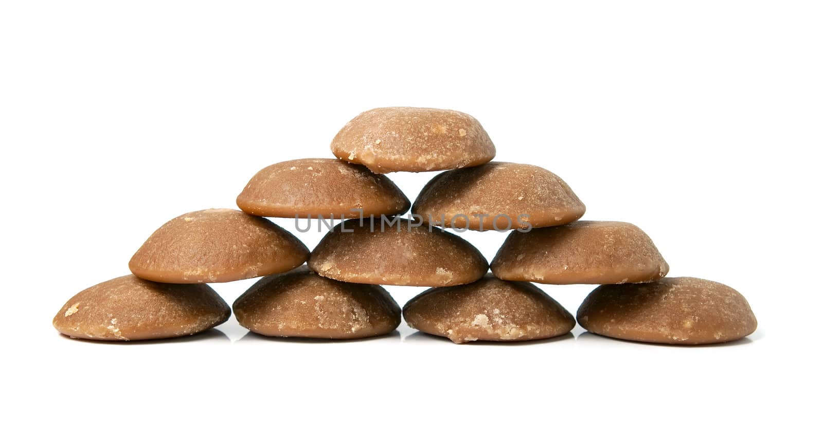 Heap of brown can sugar. Sweet and healthy. Isolated on white