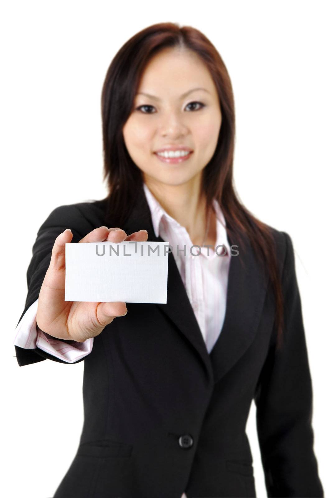 Asian businesswoman holding a blank business card and smiling at the camera
