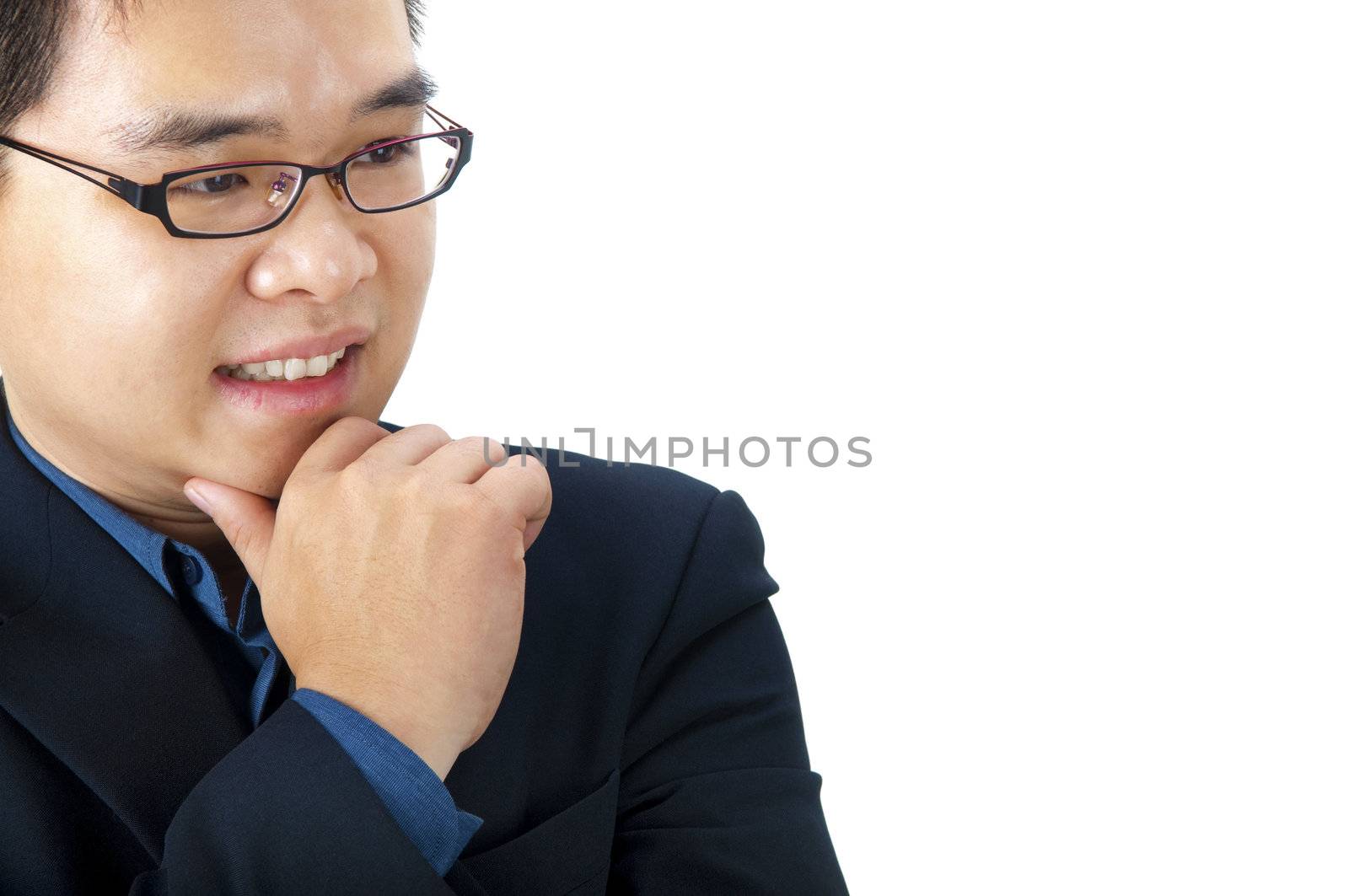 Close-up of a Asian businessman thinking.