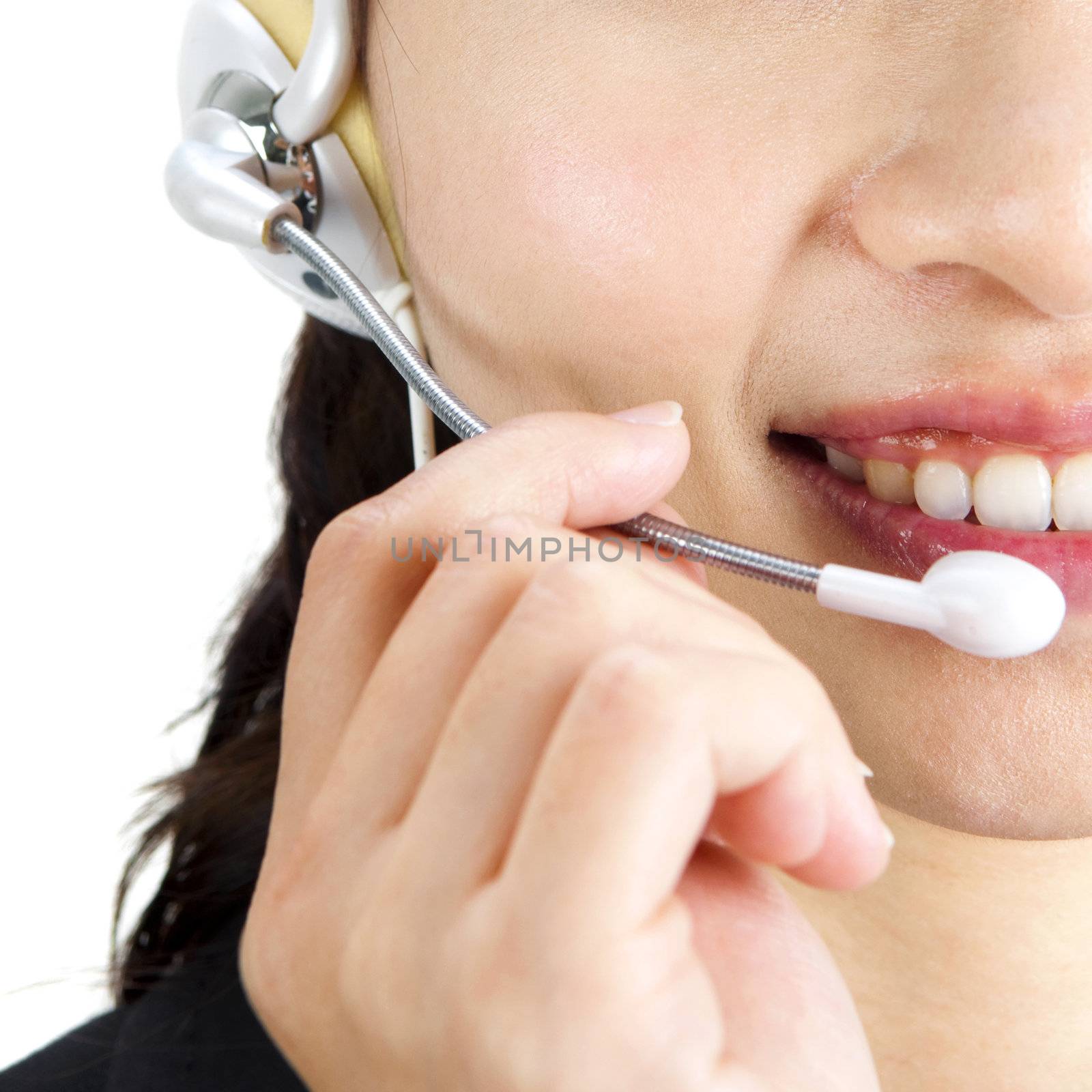 Friendly Customer Representative with headset smiling during a telephone conversation