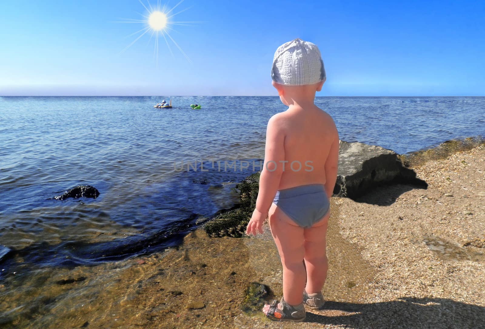 A little boy on the beach by NickNick