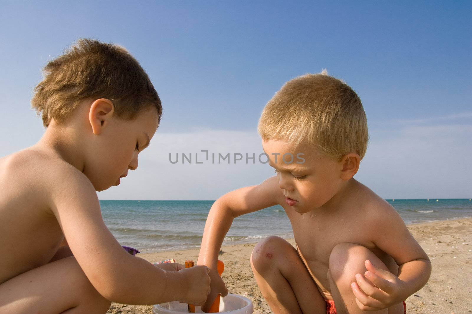 children on the beach by chrisroll