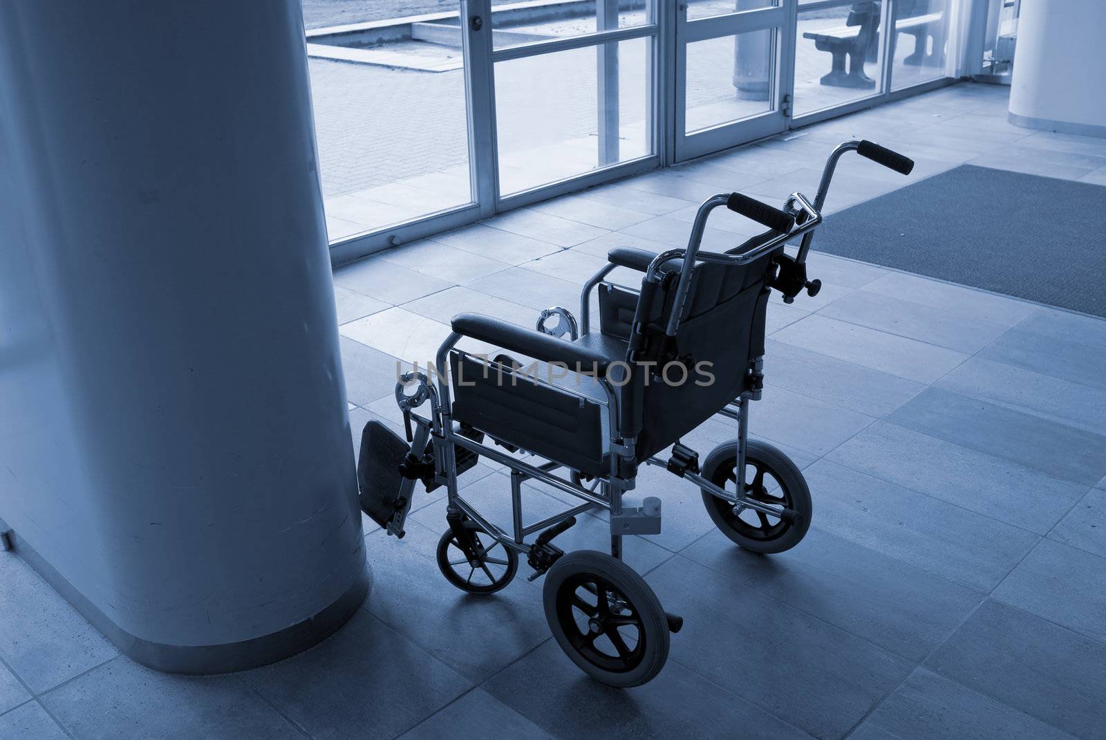 Empty wheelchair ready for use near a hospital entrance - Denmark.