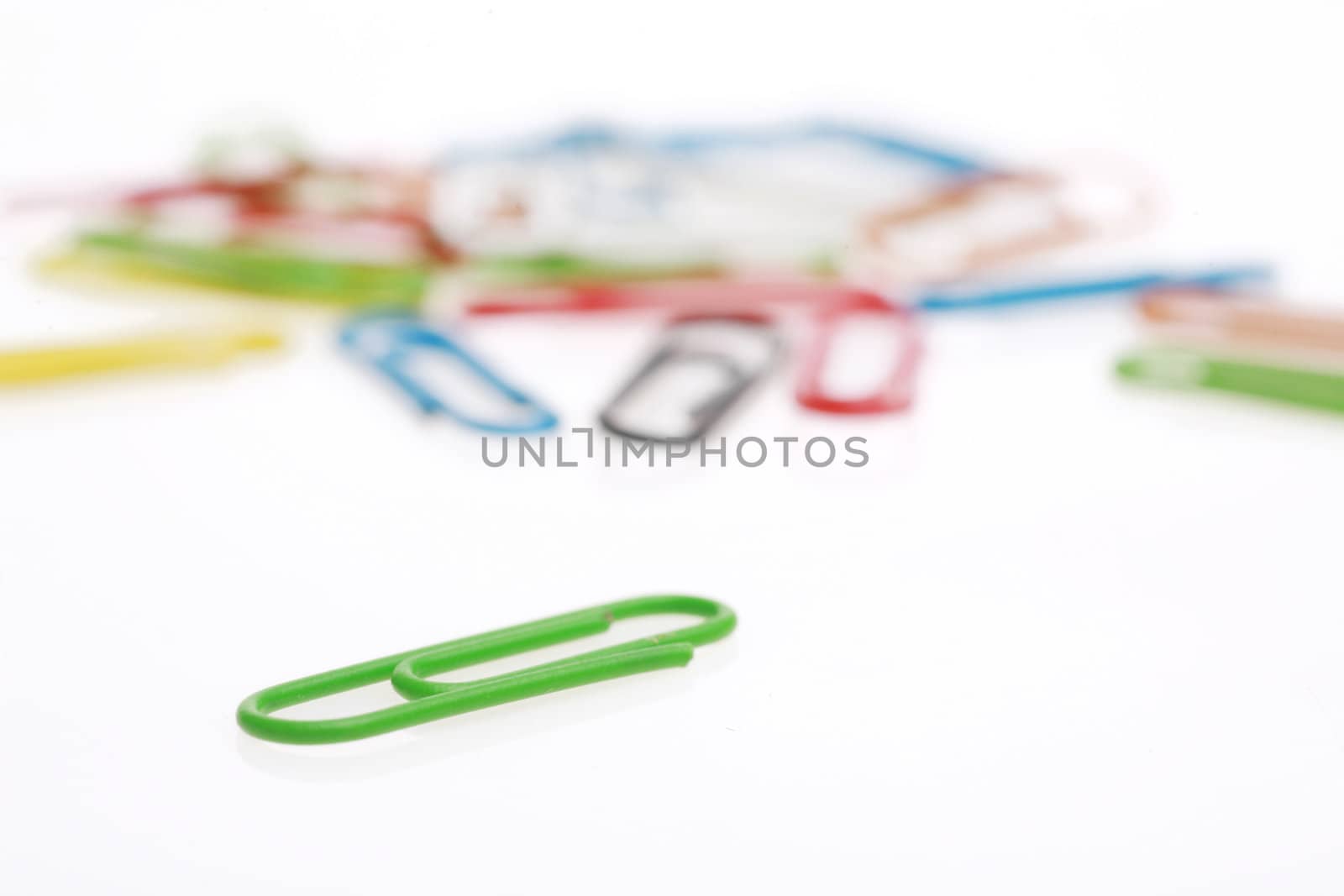 colorful paperclips on white