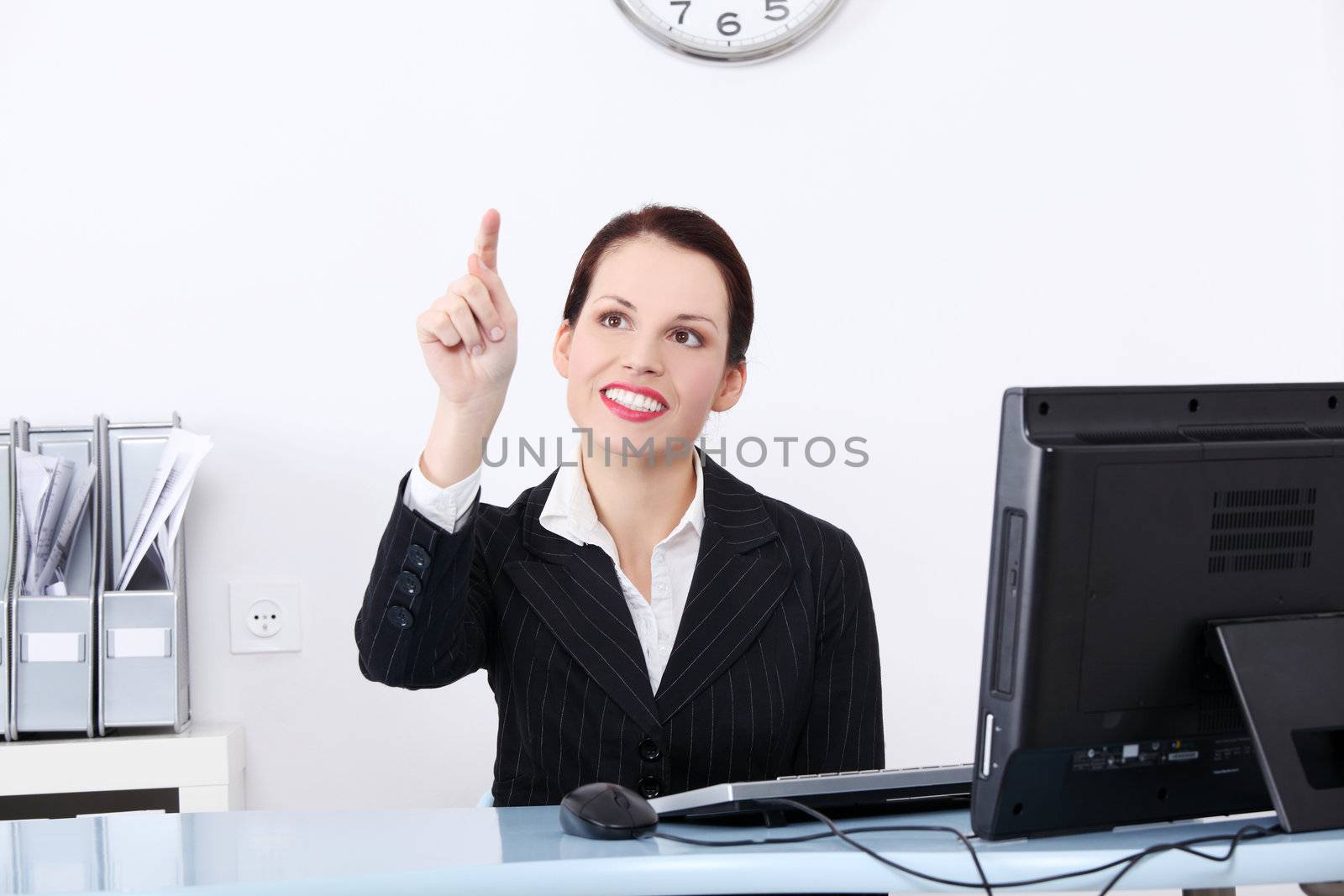 Businesswoman pushing an abstract button. by BDS