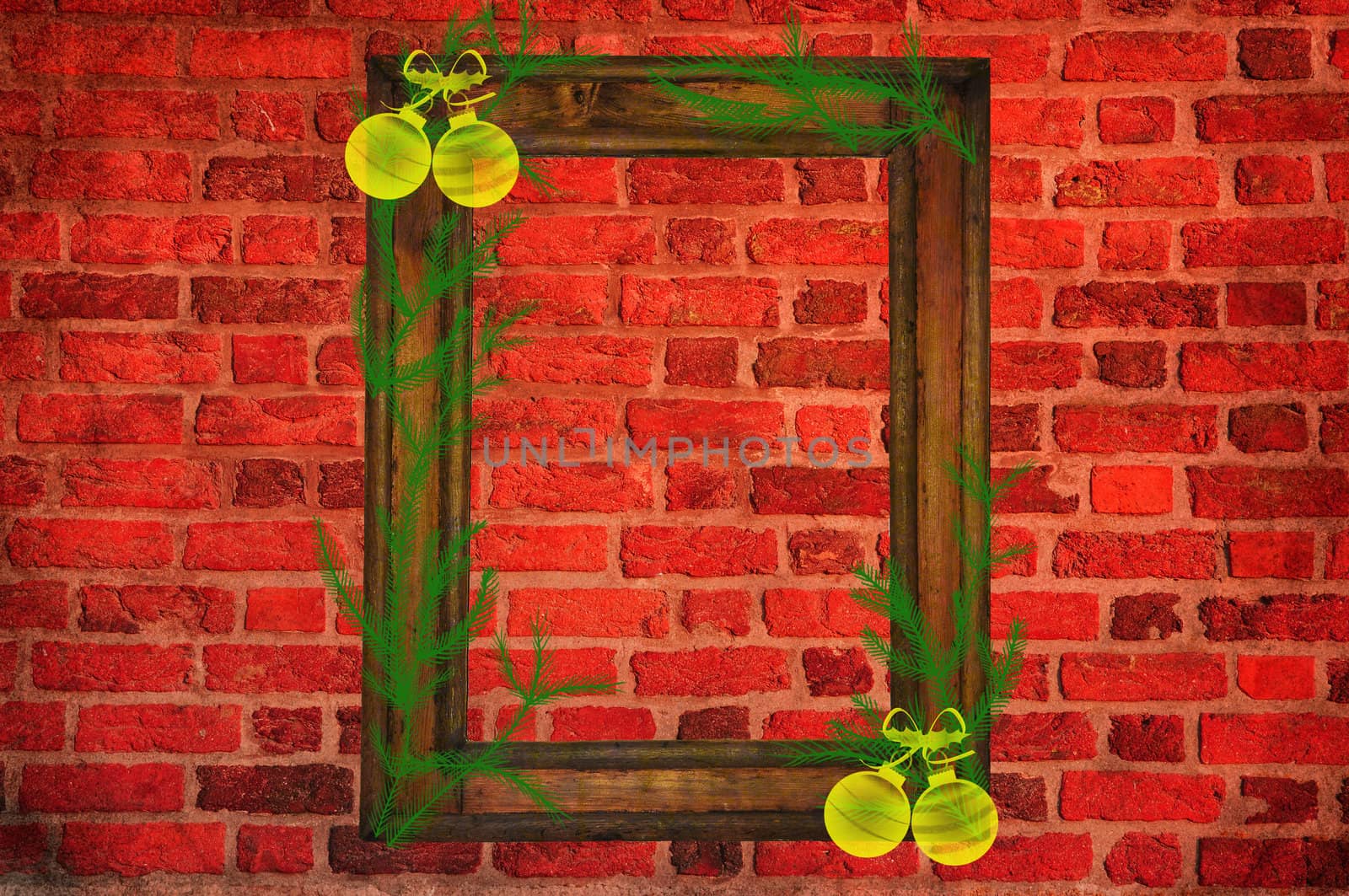 old wooden frame on brick wall with pine branches and yellow christmas balls.