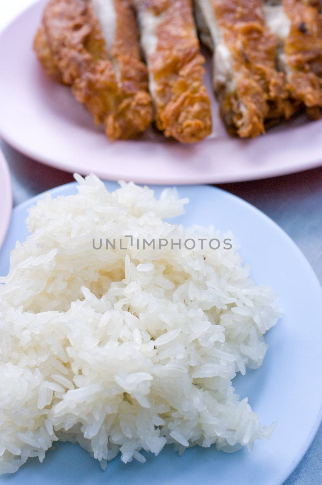 Native Thai style of Sticky rice in the blue plate