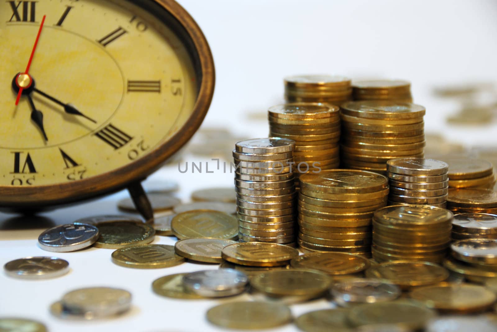 Old hours and different coins - symbol...