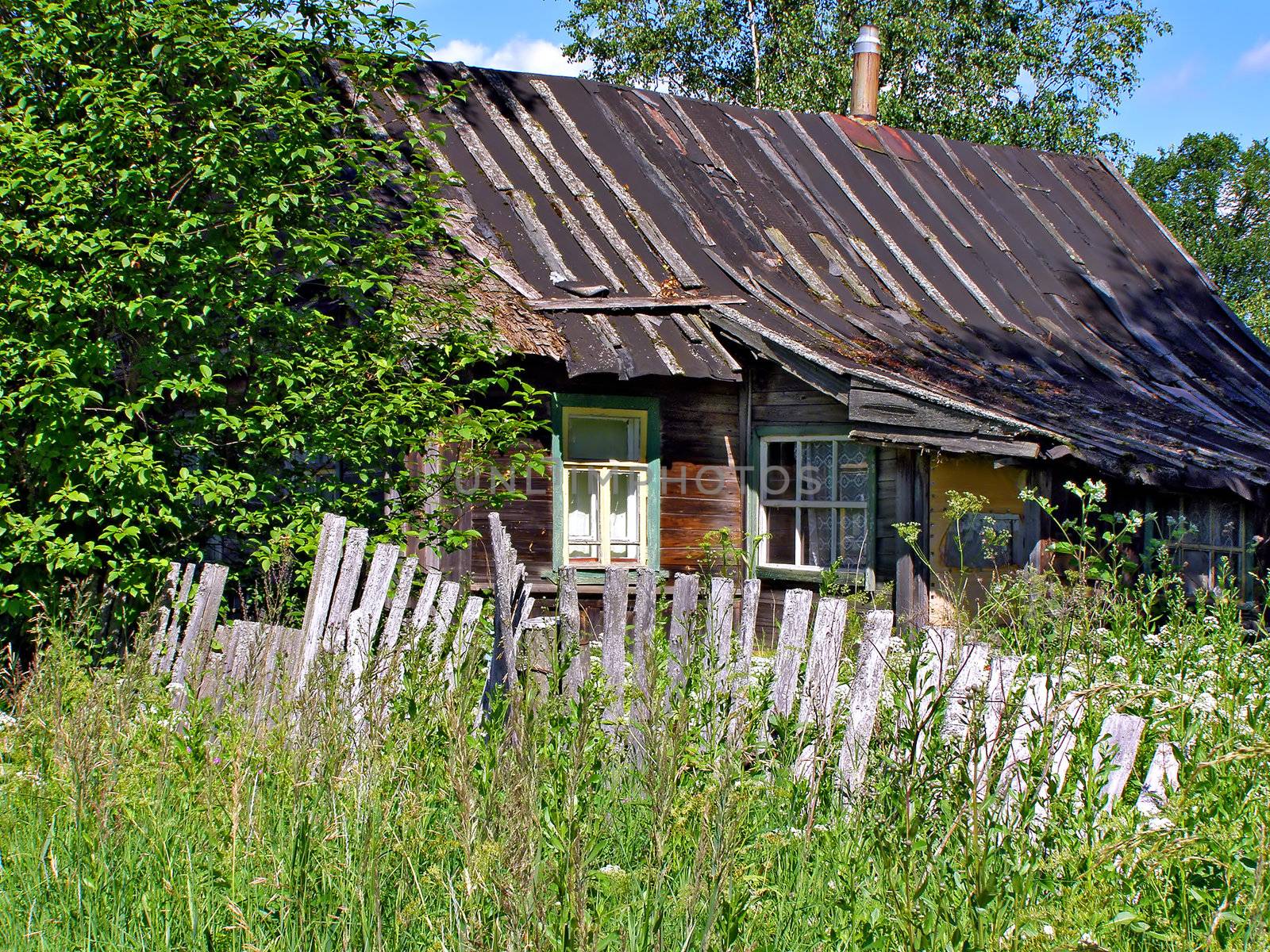 old fence near old farmhouse