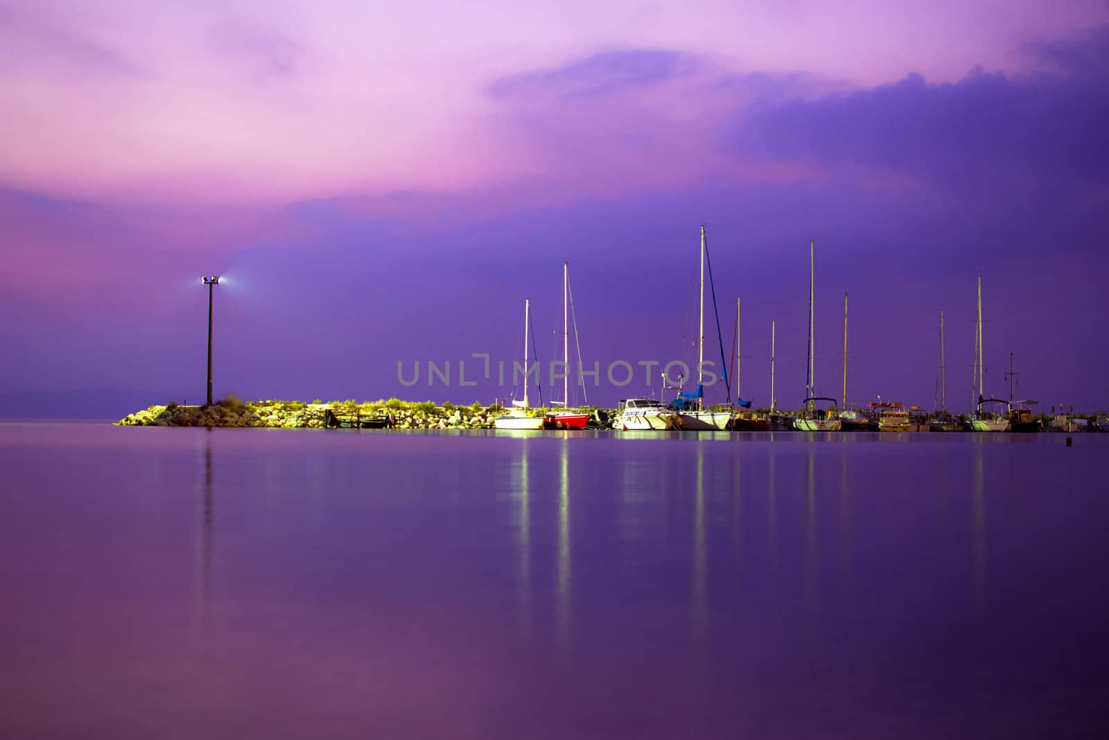 View of a yacht harbor at night. Long exposure shot