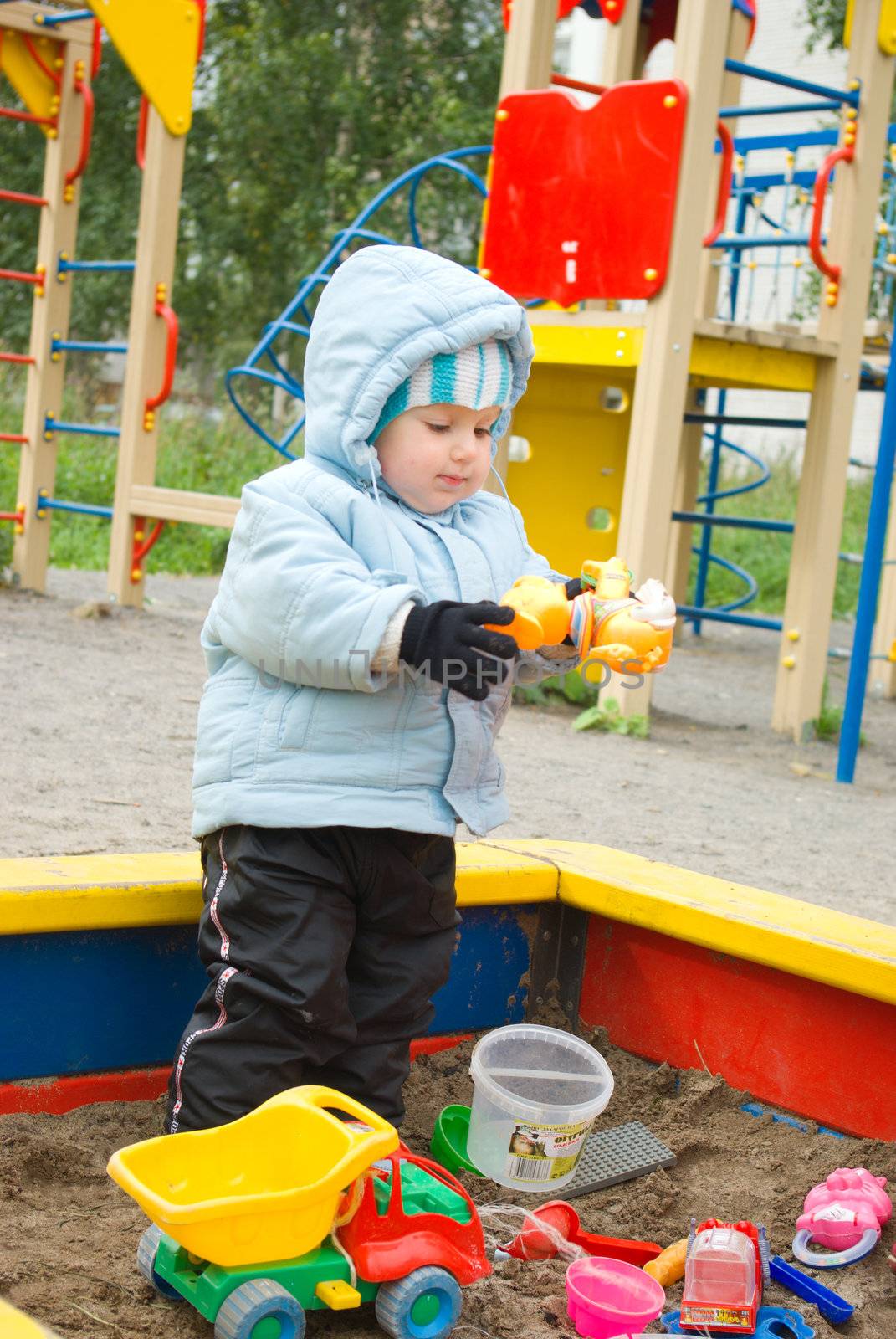 Boy Playing at the Playground.Jumping at the Playground