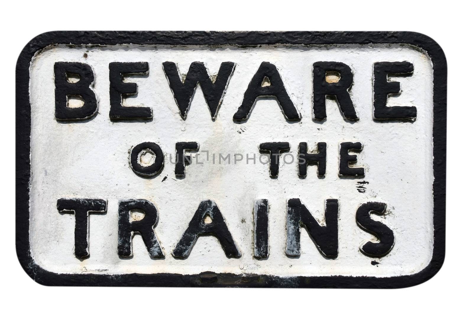 Old sign on railway track warning of trains