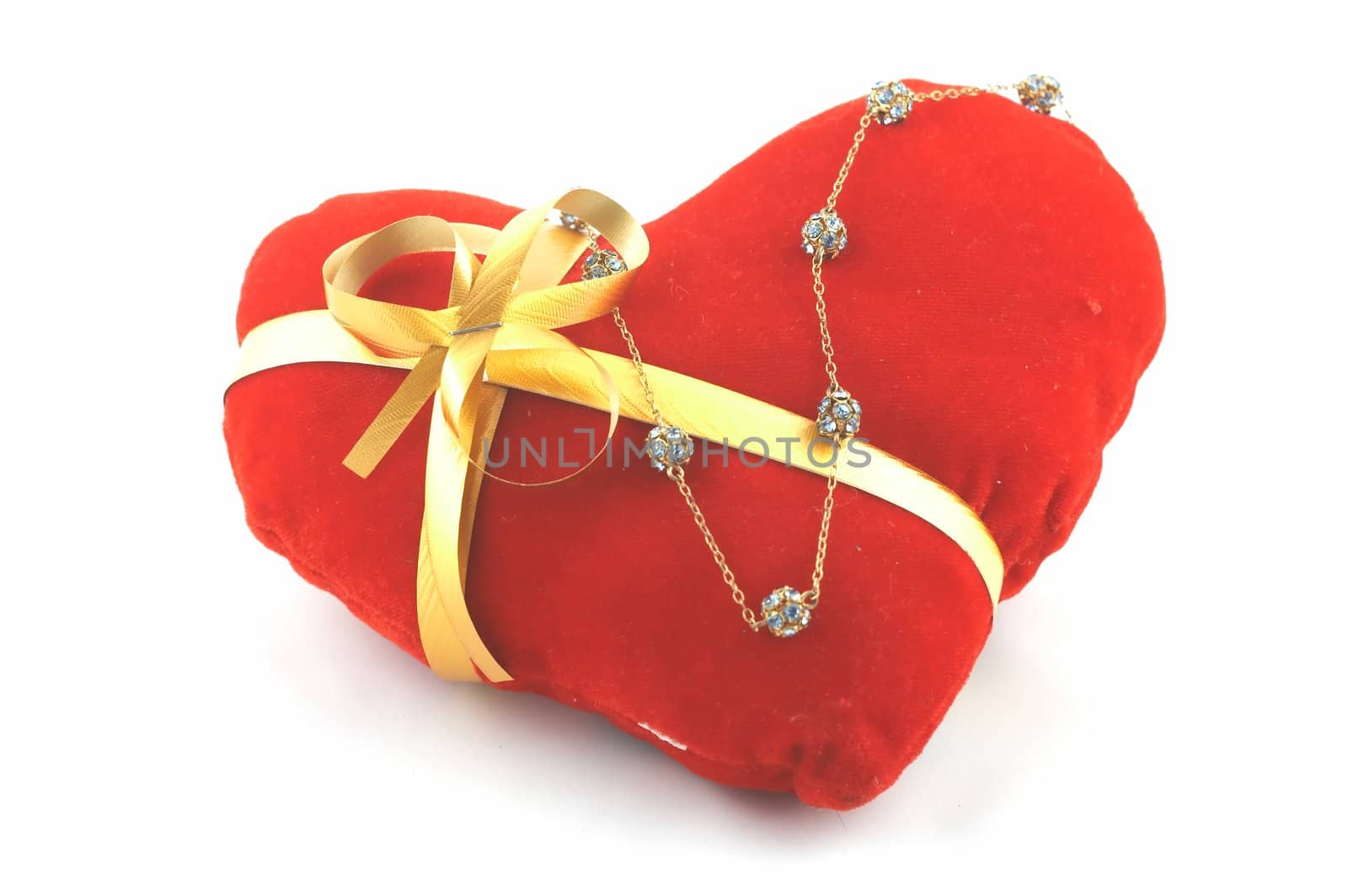 The heart which has been tied up by a tape with a bow. A gift on "Valentine's day"