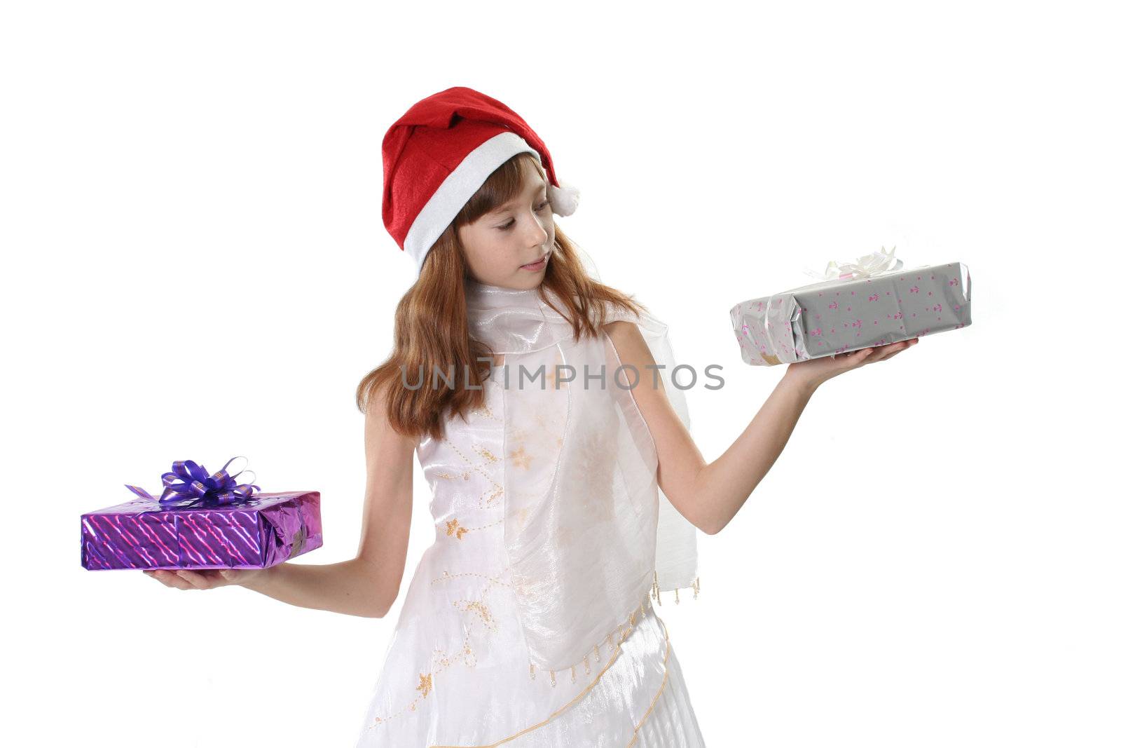 The girl in a white dress and a red hat, holds gifts in hands