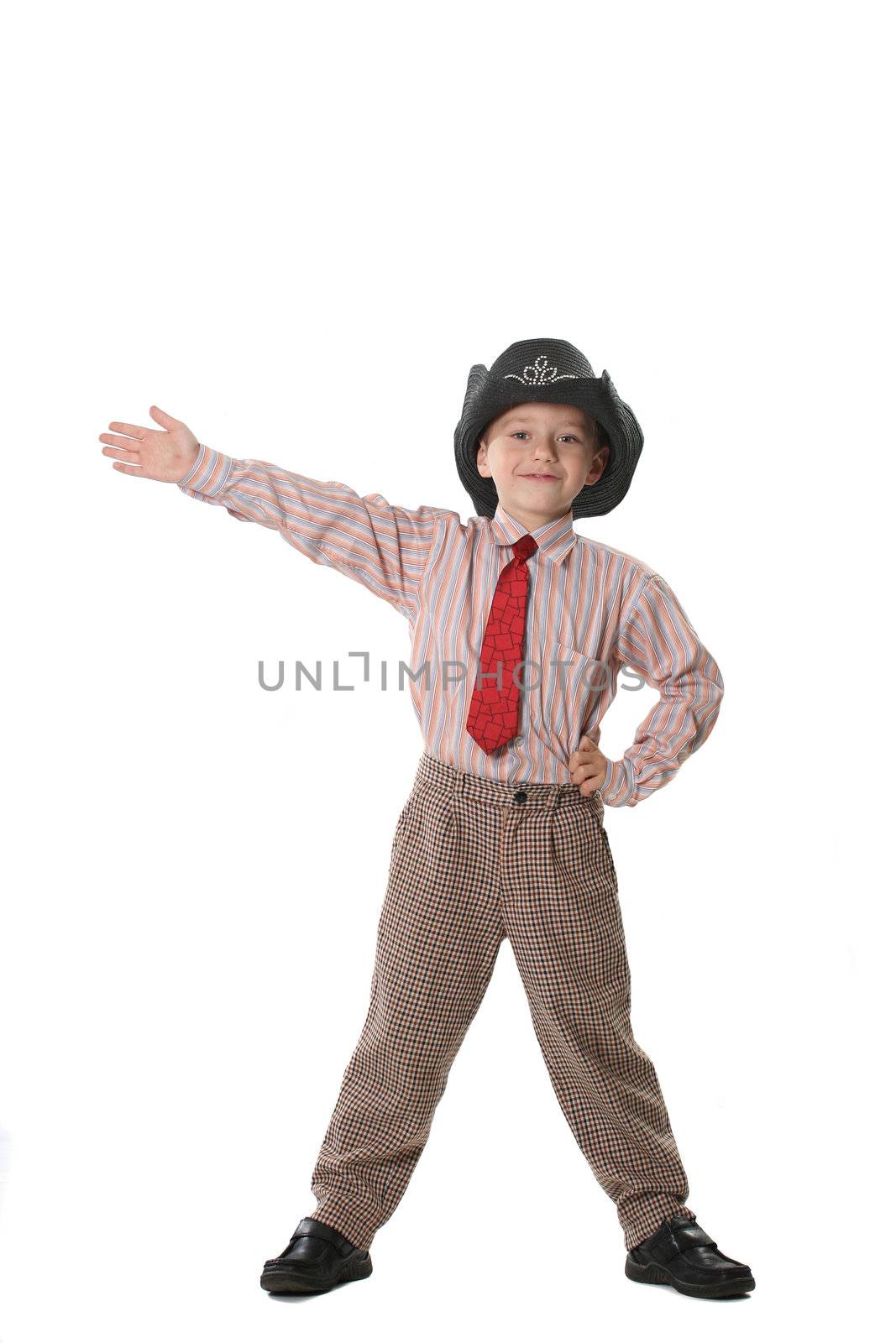 The boy in a tie and a cowboy's hat on a white background