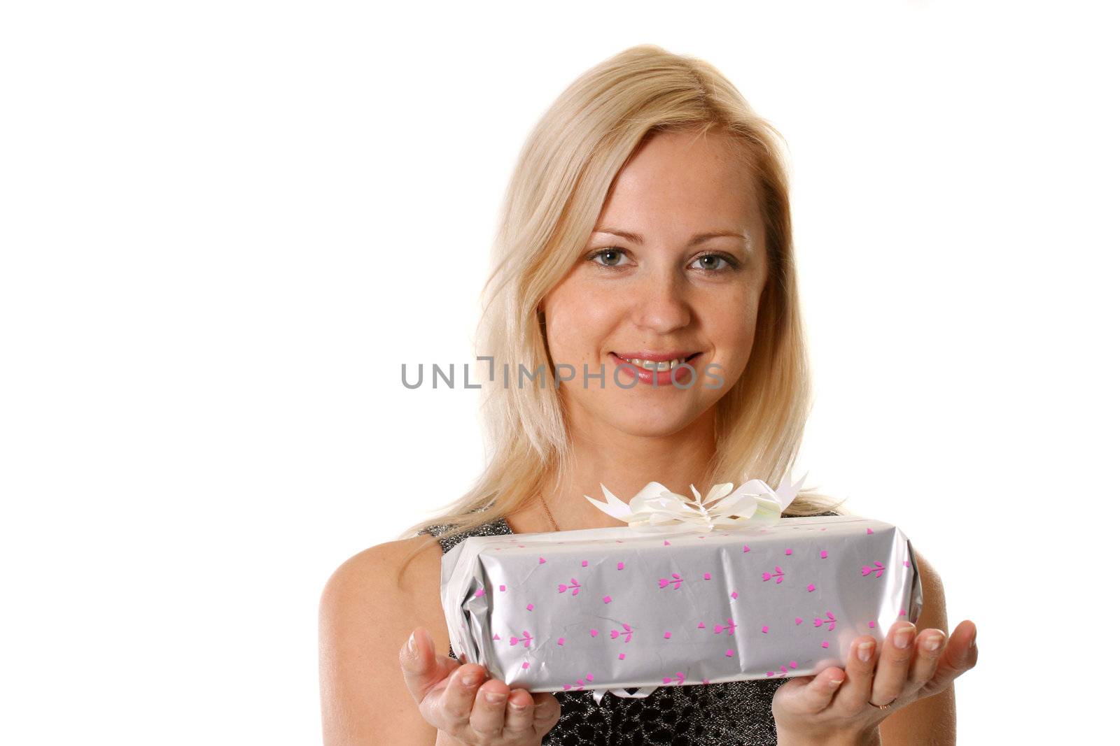The young woman holds a gift before itself