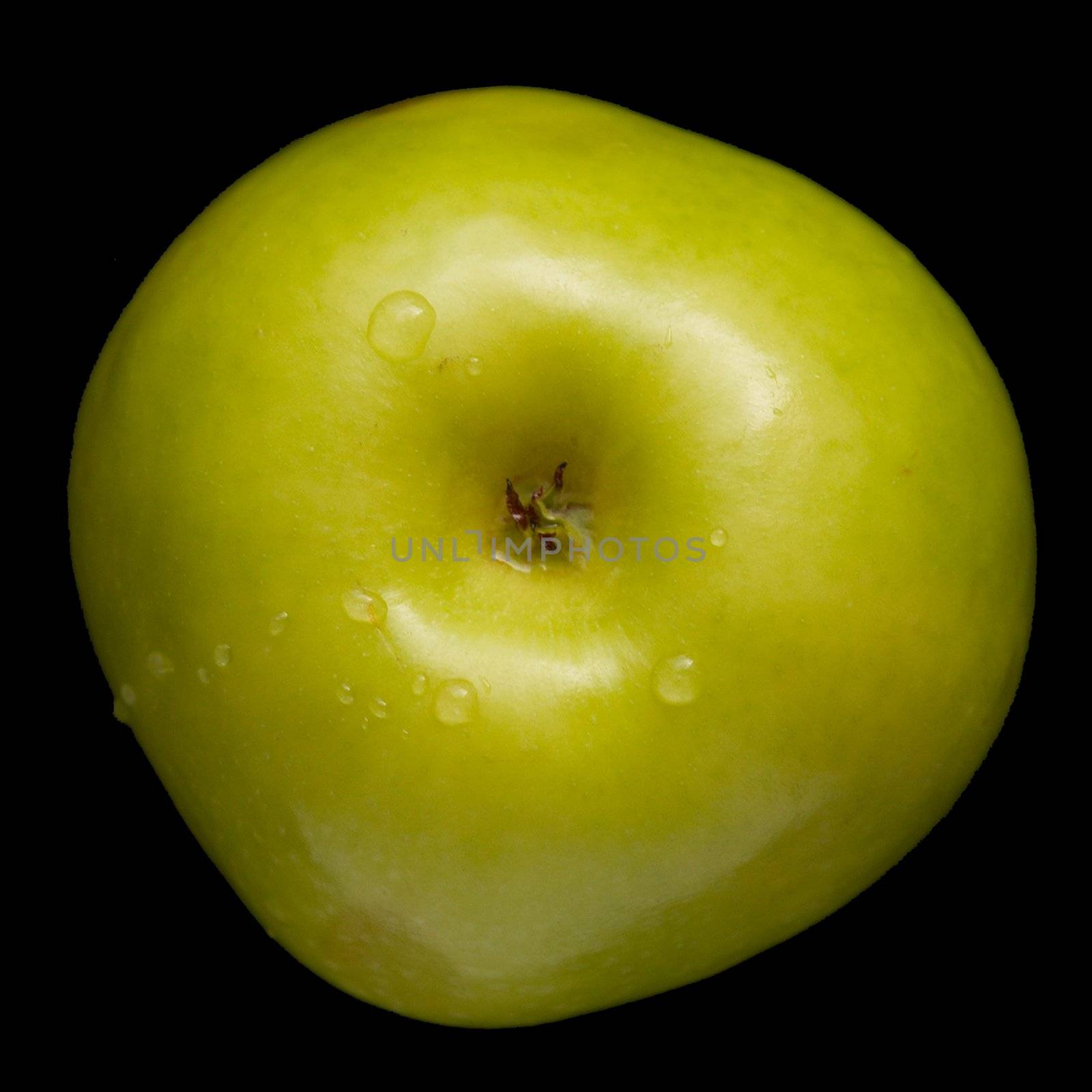 juicy green apple against the black background