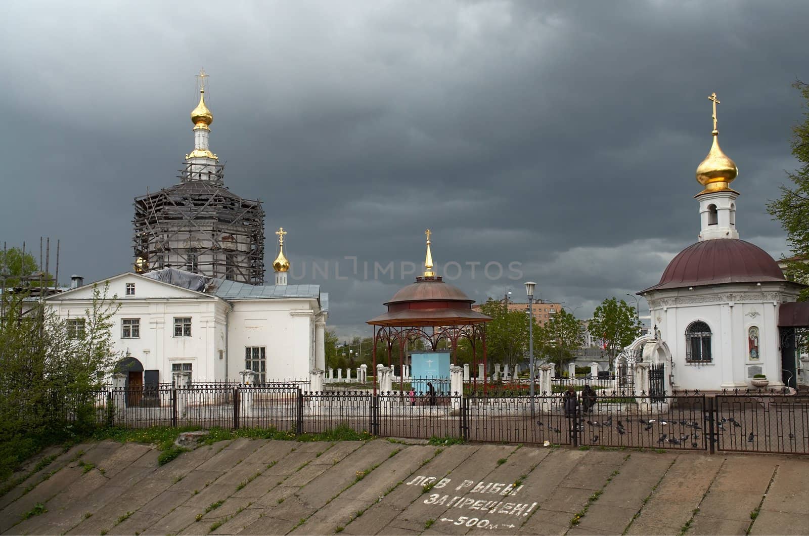 Domes of orthodox temple against the background of the cloud sky