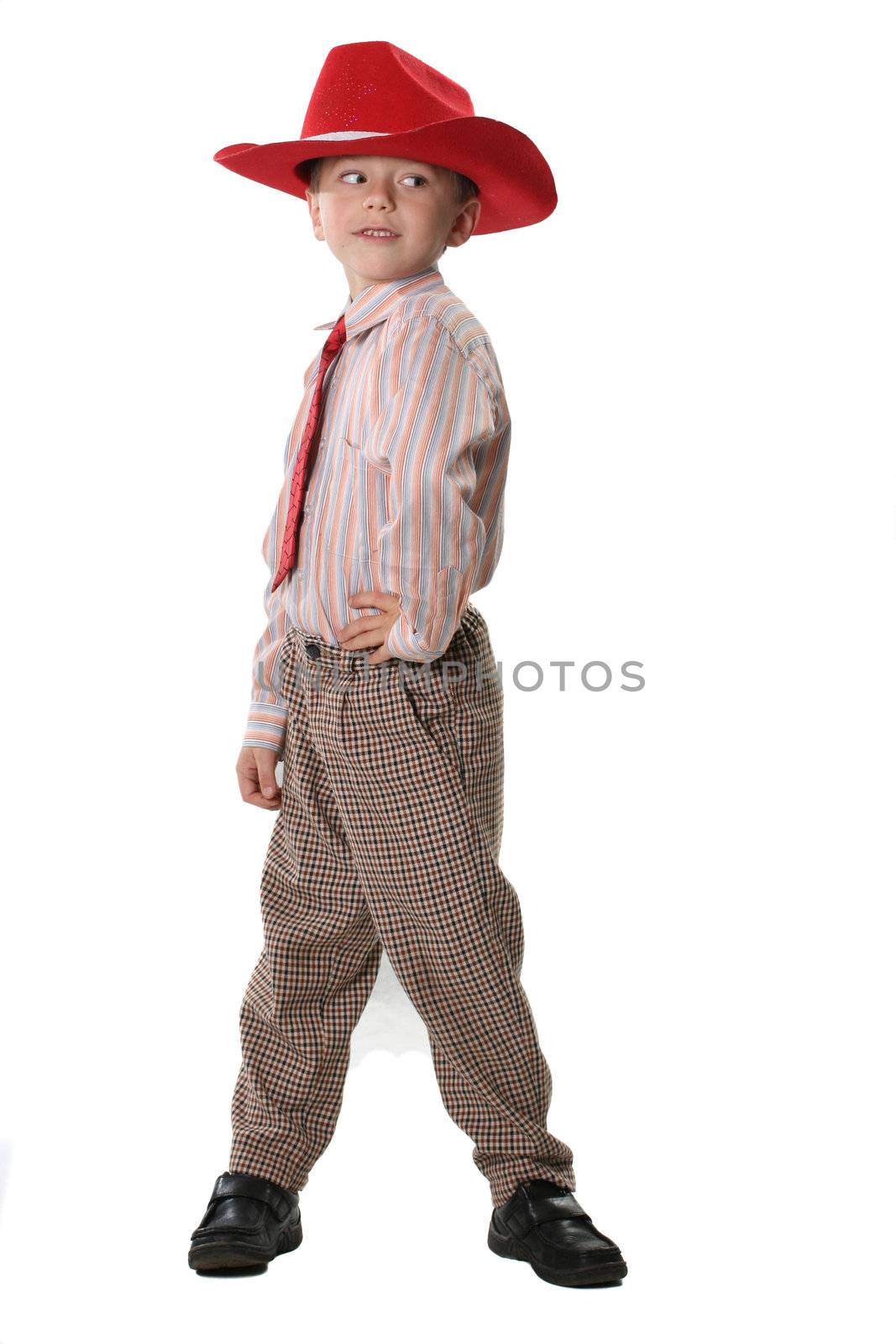The boy in a cowboy's hat and a red tie