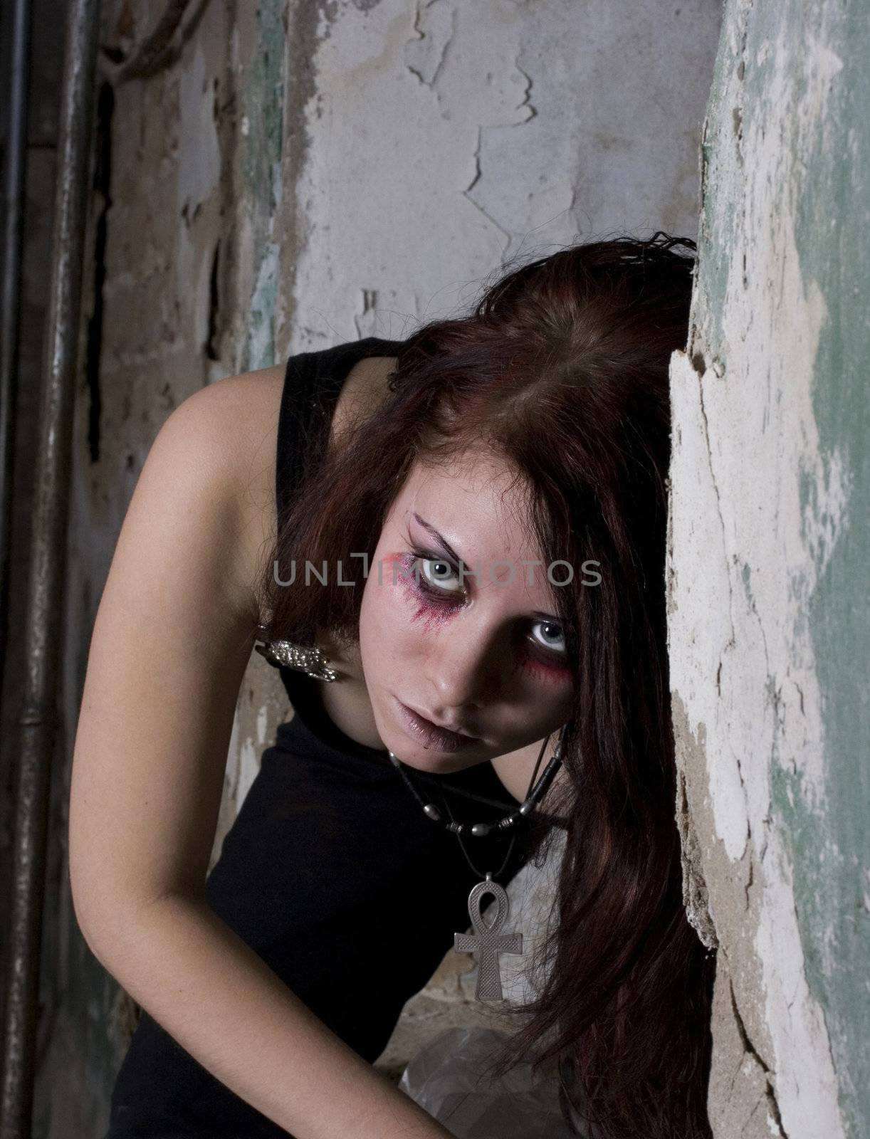 The girl in dark clothes in Gothic style a make-up