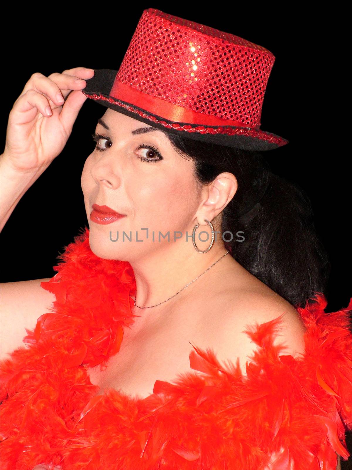 Portret of caucasian dark - hear woman; dressed for carnival, wearing red hat and  scarf plumage. Her lips are half-smiling, left shoulder is naked.
Isolated, on a black background. 


