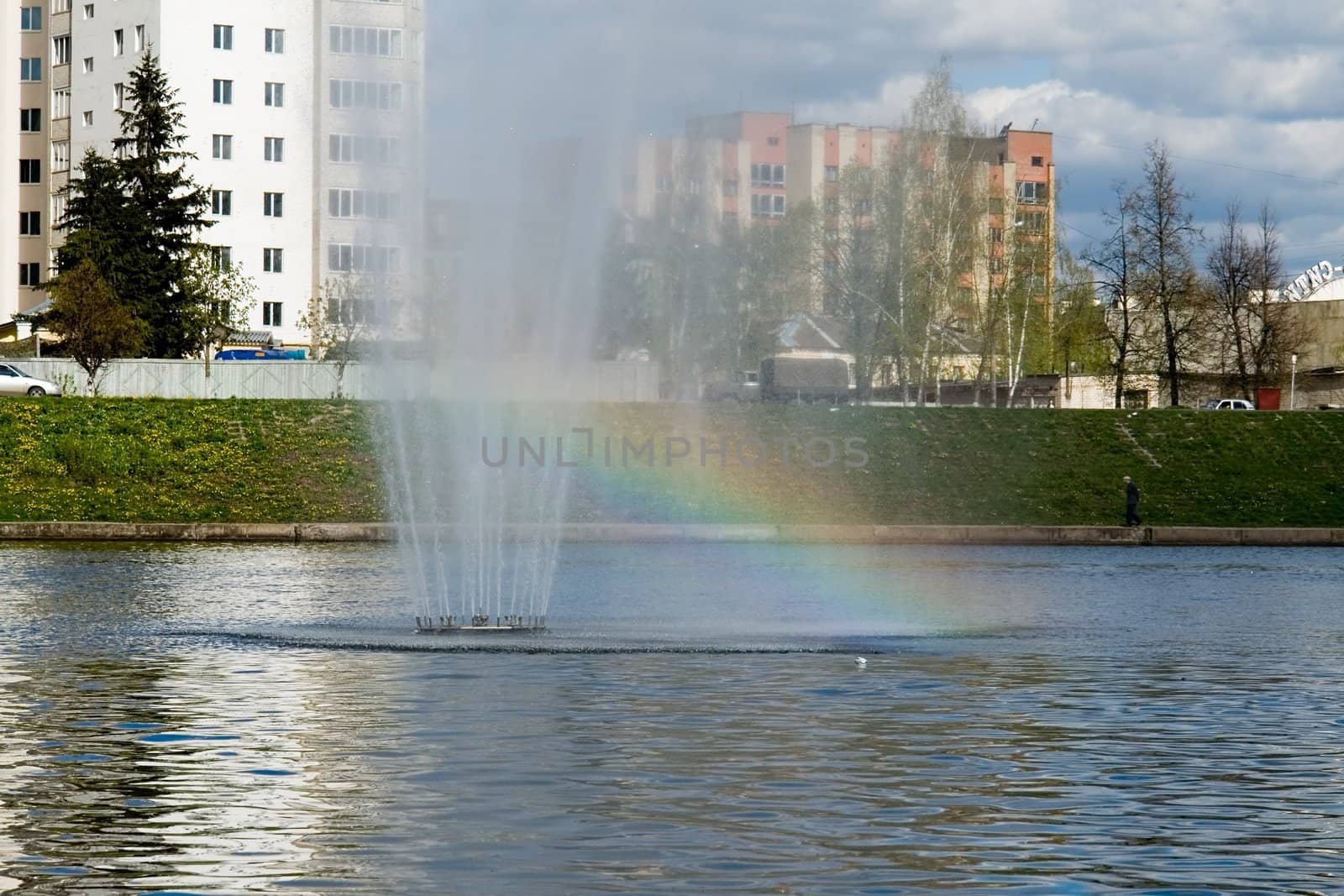 Rainbow. A little fountain in the river.