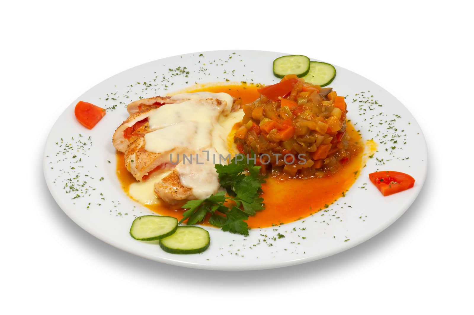 grilled stuffed chicken fillet under white sauce with stewed vegetable garnish, isolated