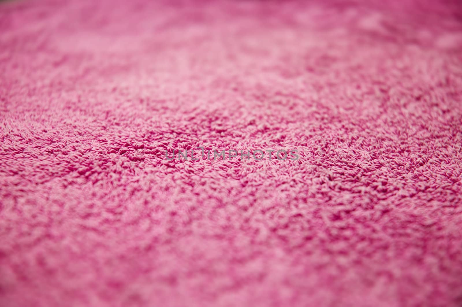 maroon towel textured background. VERY shallow DOF.