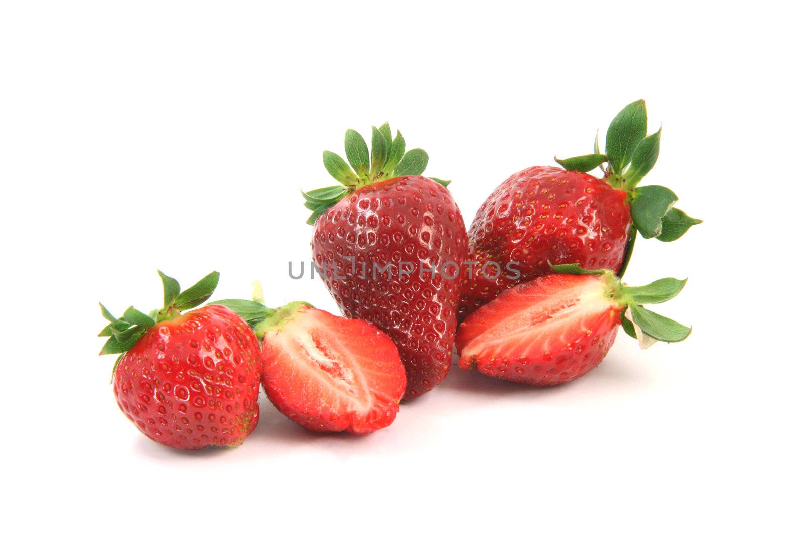 group of strawberries on is cut in half isolated on white background healthy eating