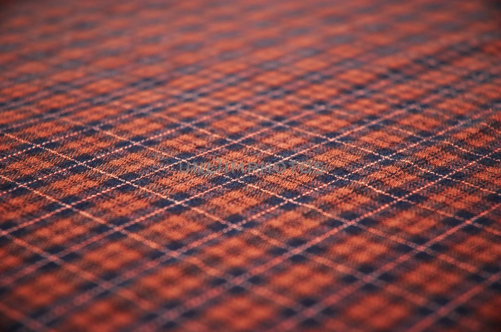 checkered celtic fabric textured background. shallow DOF.