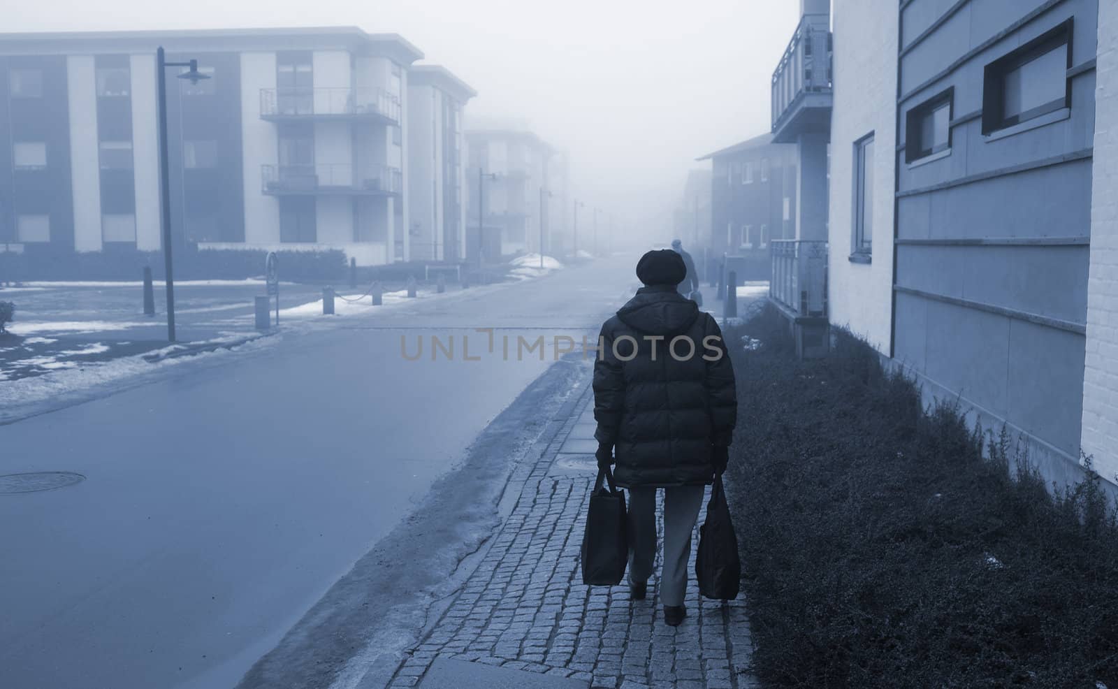 Elderly woman on her way home after the daily shopping - Denmark.