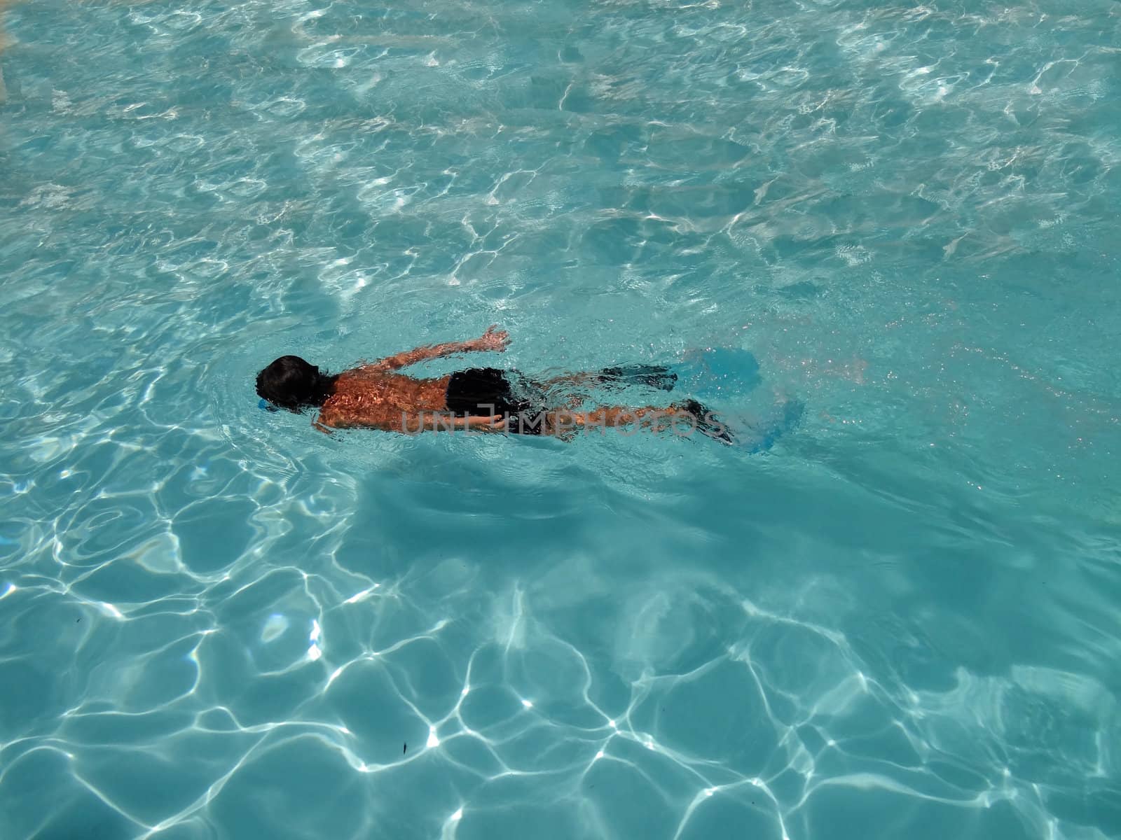 boy swimming underwater