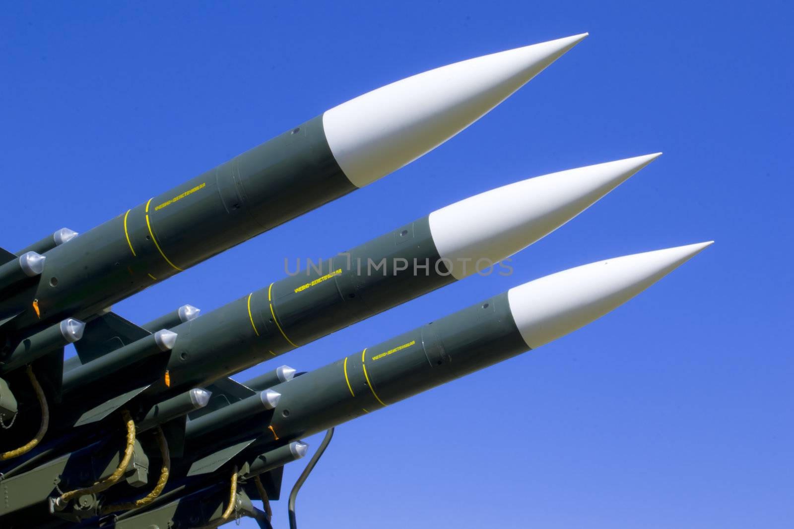 Several combat missiles aimed at the sky