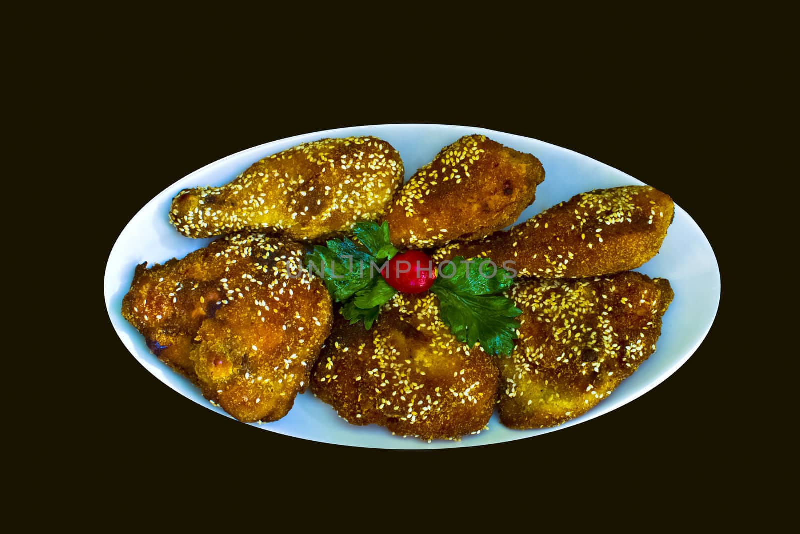 plate full of crispy chicken isolated on black by vician