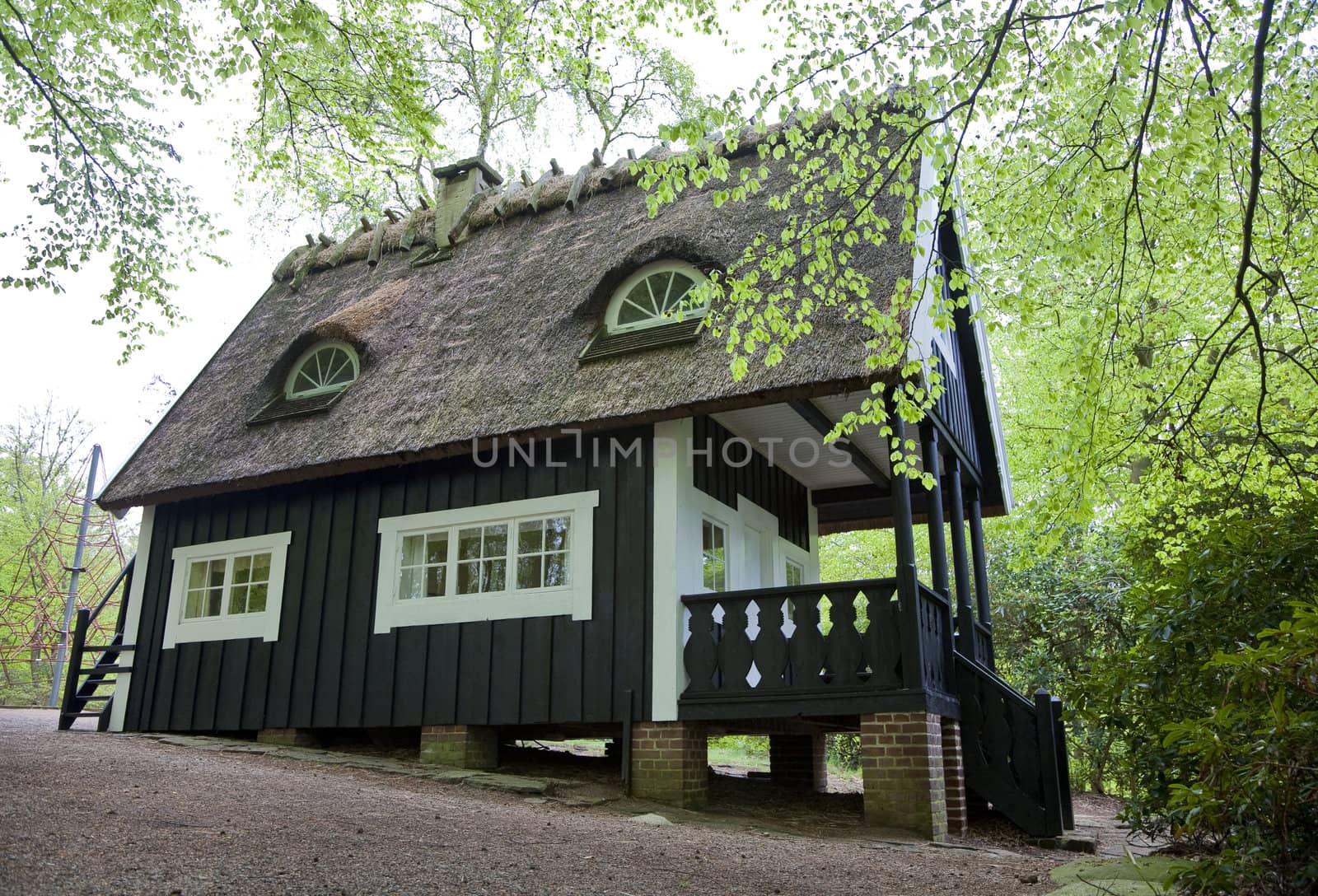 Beautiful thatched play house in the park of Sofiero - Sweden at springtime.