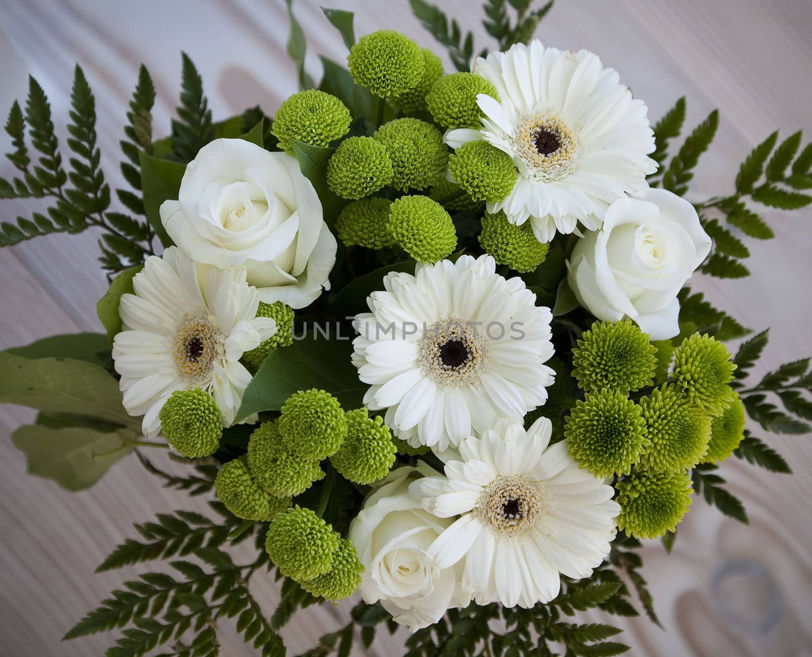 Beautiful green and white birthday bouquet with gerber and roses.