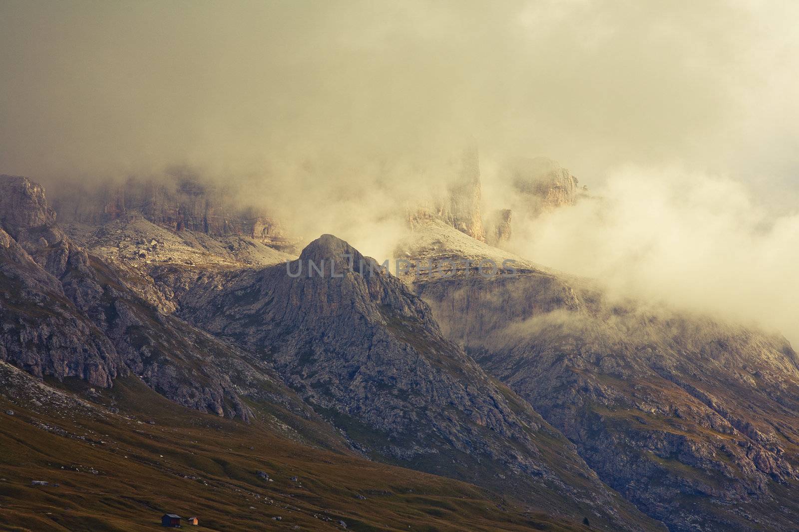 September morning with low hanging clouds in the Dolomites. Image is cross processed and a little film grain added to reflect age.