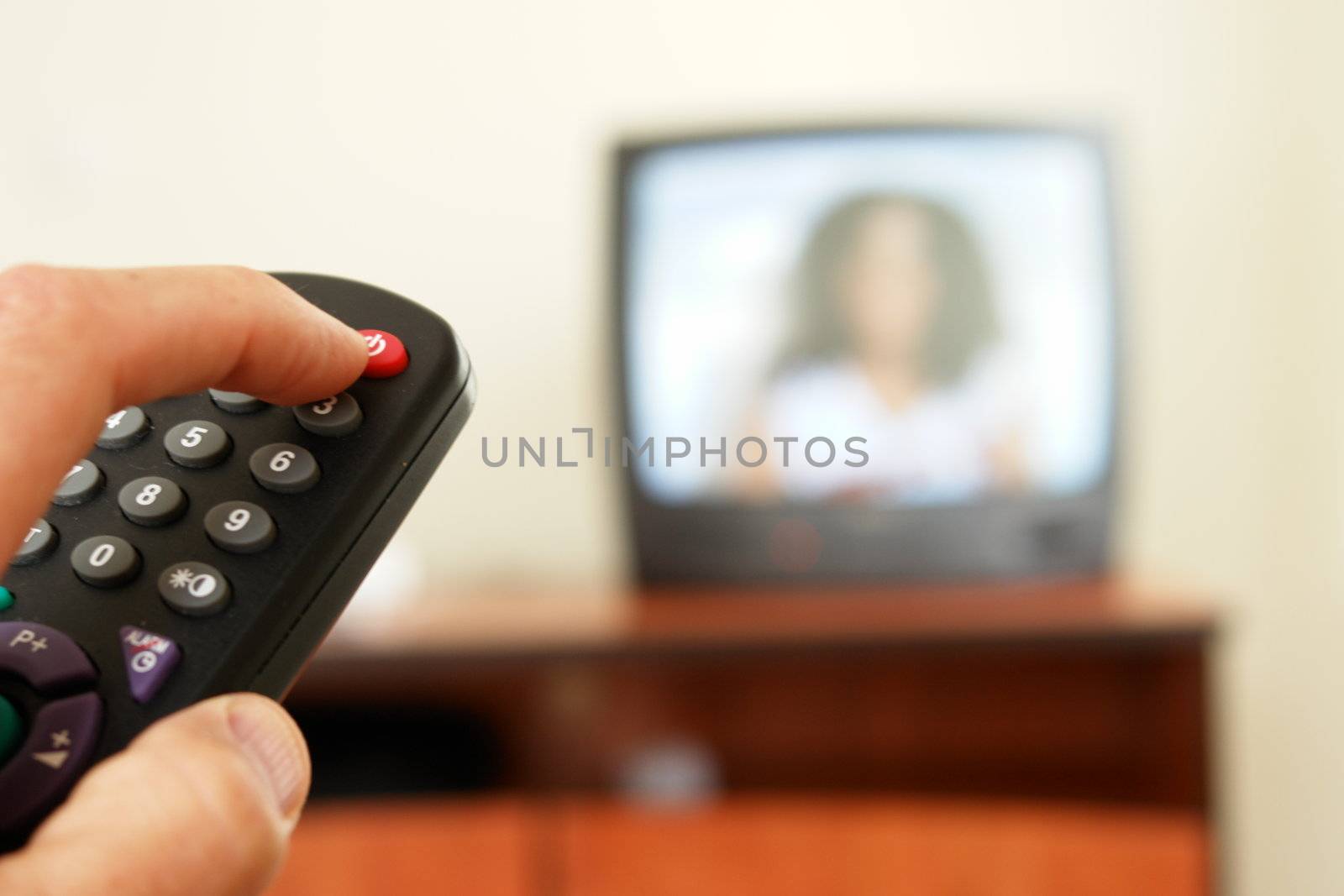 Television screen with tv remote control  in foreground.....