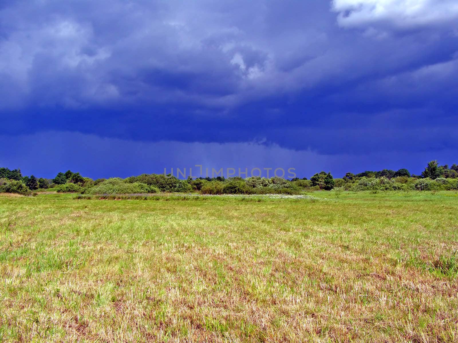 cocked field before thunderstorm